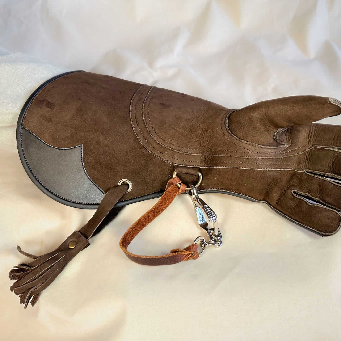 An Eagle Full-Cuff long falcon gauntlet made with Calf Leather looking at the palm with the (not included but available for purchase) French snap and leather thong. 