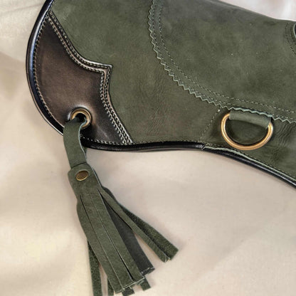 A Forest Green Full-Cuff long falcon gauntlet made with Calf Leather looking at a detailed view of the cuff and tassel.