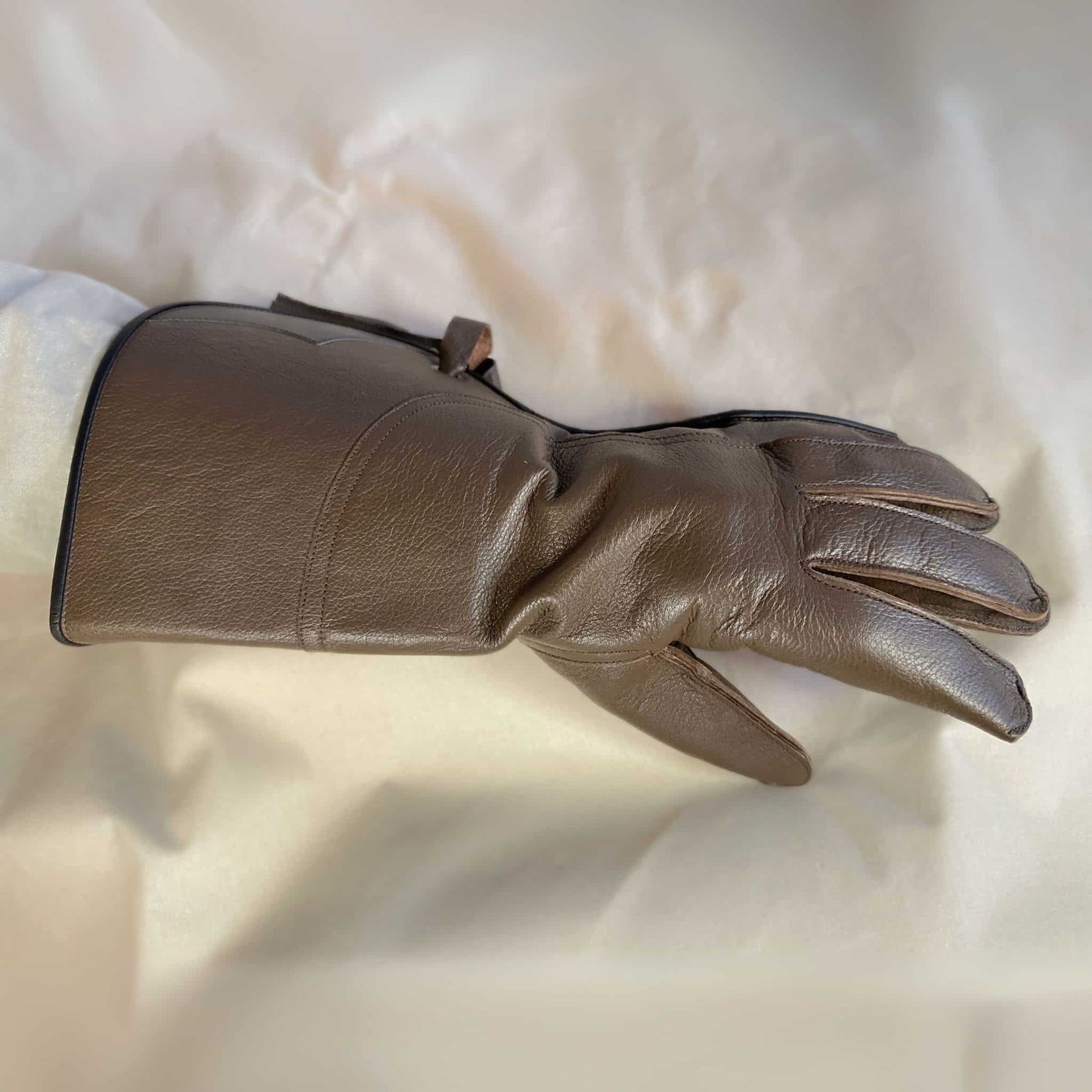 A long Full-Cuff brown falcon gauntlet made with Kangaroo Leather looking at the back of the hand.