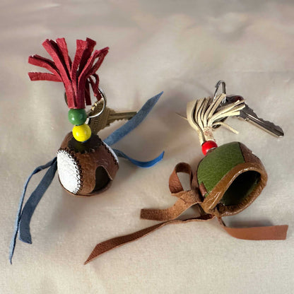 Two miniature sewn hood examples with a key ring.